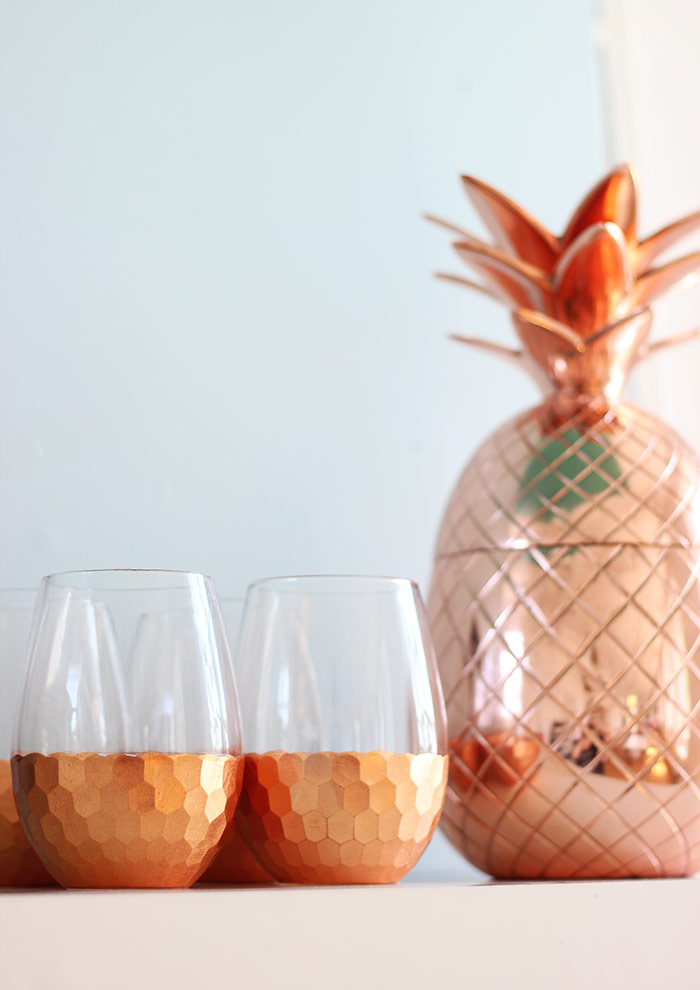 Copper pineapple and wine glasses bar accessories